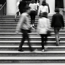 multiple people walking up stairs by richard avedon. street photography. black and white. ilford delta. long exposure, extreme motion blur. film grain. contrast.