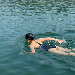 girl swimming inside a lake