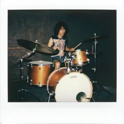 1 9 7 0 s polaroid of a squid playing a huge drumset