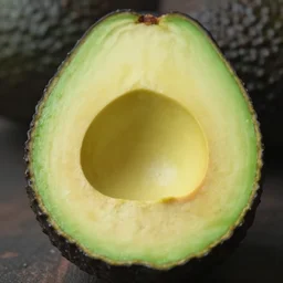 a cinematic photograph of a perfect avocado half with only a tiny center piece and lots of flesh, ultra realistic, 4 k