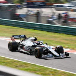 an f 1 train!!!!!!!!!! on its qualifying lap, on a racetrack