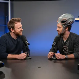 joe rogan doing a podcast with a gray alien creature, photo, realistic studio lighting, 4 k, 8 k, hd, 3 9 mm lens