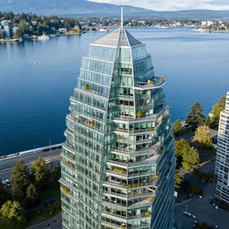 glass skyscraper treehouse, water at  vanvcouver,british columbia,canada,aerial view