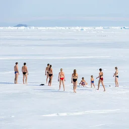 people in swimsuit on the pack ice, telephoto vacation picture