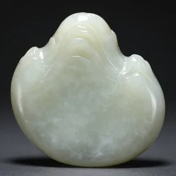 carved jade sculpture in the shape of a beautiful mountain