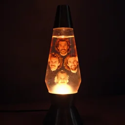 a lava lamp with floating Jack Black heads inside