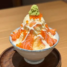 dslr food photograph of ice cream sundae topped with salmon roe and wasabi drizzle, 8 5 mm f 1. 8