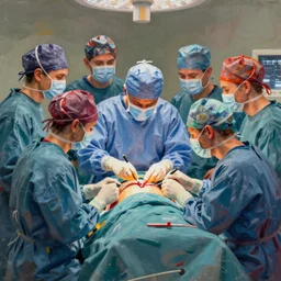 a beautiful assemblage of a team of surgeons gathered around a patient on an operating table, with one surgeon in the process of cutting into the patient's chest. the assemblage is full of intense colors and brushstrokes, conveying the urgency and intensity of the surgery. south park by claude cahun, by herbert list composed