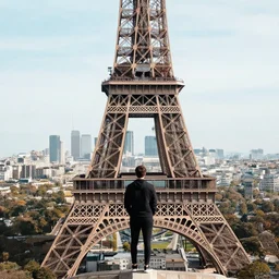some guy on top of the eiffel tower, how?