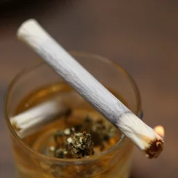 marijuana joint being lit'close up photograph