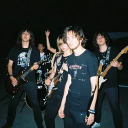 kuvshinov ilya painting of an anime metal band photo, direct flash photography at night, film grain