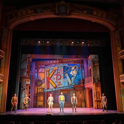 photo of a huge theaterstage, play is west side story, 3 actors on stage, 8 k, multicolored, exaggerated detailed, long shot