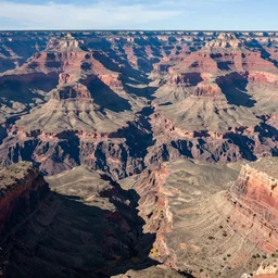 view from a helicopter looking down into the grand canyon, photorealistic
