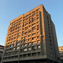Beautiful Photograph of a Brutalist socialist modernist Building, lowshot, golden-hour