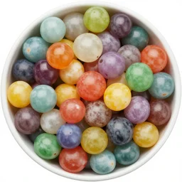 a bowl full of coloured marbles top down view