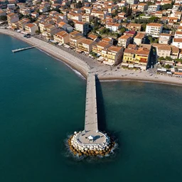 a drone shot of the pier in Lido di Ostia, aerial view, photograph, photorealistic, detailed, sharp image, 8k SDR, award-winning, beautiful,