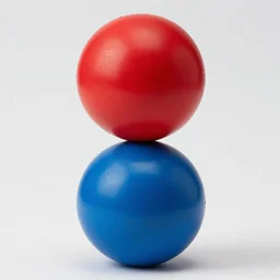 red ball on the top, blue ball on the bottom. product photograph