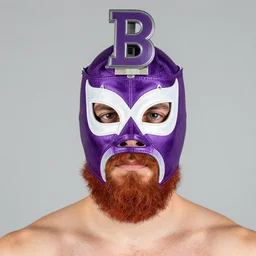 a red bearded man wearing a purple luchadore half-mask, a big rubber B attached to the top of the mask