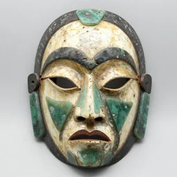 symmetrical product photograph of a tribal mask made from bone and obsidian
