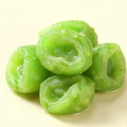 food photography. green sweet and sour food item, fresh, light. studio lighting. intricate details.
