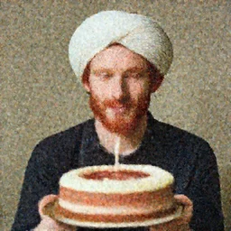 Red haired man, dressed with a turbant, with a birthday cake