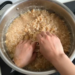 a pot full of mince being mixed up by hands, pov, 4 k