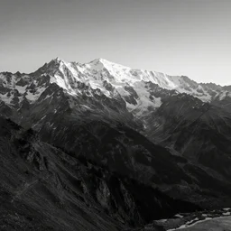 award winning landscape photography of mont blanc, wide angle, high contrast, black and white, peaks lighten up by morning sun, beautiful light