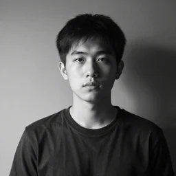 a young man grayscale portrait photo. split light.