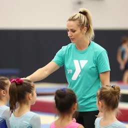 blonde ymca gymnastics coach with aquamarine green t shirt with y logo on it teaching kids gymnastics, high detail, good lighting