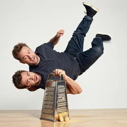 A photo of a man falling into a cheese grater