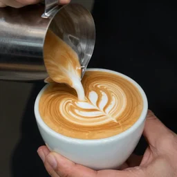 latte art is a method of preparing coffee created by pouring microfoam into a shot of espresso and resulting in a pattern or design on the surface of the latte. it can also be created or embellished by simply drawing in the top layer of foam.