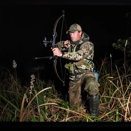 trailcam footage of morrissey hunting an animal at night with a bow