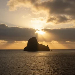 a spectacular hyper real photo of the tyndall phenomenon when the golden sun shines through the clouds on the sea, by unreal engine.