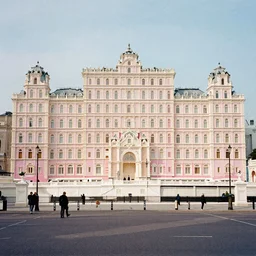 London Street in the style of The Grand Budapest Hotel, a sunny day, 35mm, Kodak Vision3