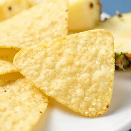professional close up food photo of a tortilla chip with blue pineapple, highly detailed