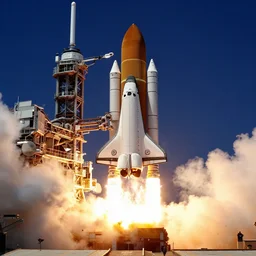 a space shuttle launching from a launchpad