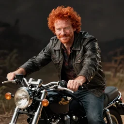 portrait of redhead man on a motorcycle By Emmanuel Lubezki