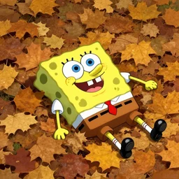 Spongebob laying in a pile of autumn leaves