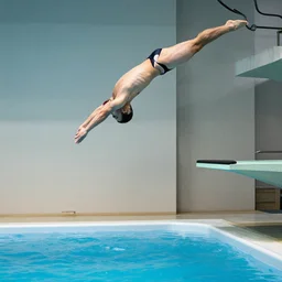 a man diving from a 1 0 0 m diving board into a hot tub