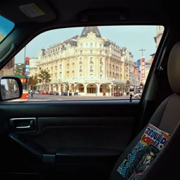 fuji 5 0 r, 3 5 mm ; ronin film still of blade runner car interior with front seat side window view with a background projection of beautiful hyperrealistic film still from ronin ( 1 9 9 0 ) negresco hotel vista scene directed by wes anderson with a street in style of 1 9 9 0 s frontiers in miniature porcelain kintsugu design magazine seinen manga edition, real - life seinen manga porcelain sci - fi font izakaya sign, highly detailed, cinematic lighting, 8 k