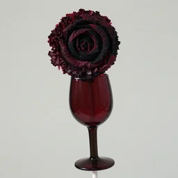a photo of a lollipop with a dark red wrapper in the shape of a wine glass on a dark green asparagus stick wearing a kermit collar, the top is a black and dark red vortex made of velvet shards in the shape of a head of dark red butter lettuce