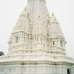 confusing white marble temple. soft lighting, film photography