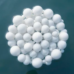 many white spherical soap bubble cells divide, on the calm water surface, designed by antti lovag