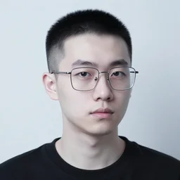 a man in his mid twenties with thin square glasses, hair is very short on top with skin fade on the sides, pale white skin
