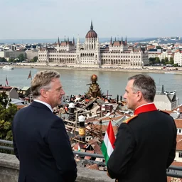leader of fascist hungary, viktor orban, overseeing the war torn city on the bank of danube river in budapest during the siege 1 9 4 5, by edward hopper