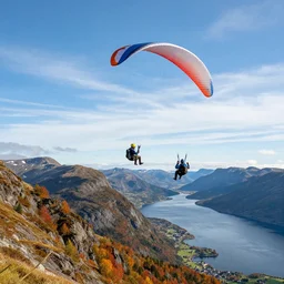 ! dream an award winning photo of 2 paragliders floating through the air, background is ulriken mountain in bergen norway, colorful autumn leaves, beautiful mountains, breathtaking blue sky, wispy clouds, travel photography, conde naste, travel channel, charlie waite, max rive, caroline foster.
