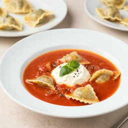 a vibrant still life photograph of tomato consomme and smoked ricotta tortelli, kodak portra, f 1. 8, gastronomica magazine