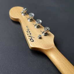 sweet ashtray bridge - stratocaster saddles - 3 single tele coils with a 5 - way switch for options. fake jewels on the tone and volume knob. nacho cheese poplar wood with the bolt on neck. surf rock look