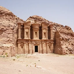 ruins of an old middleast city like petra houses carved from mountains in an open desert no signs of life anymore