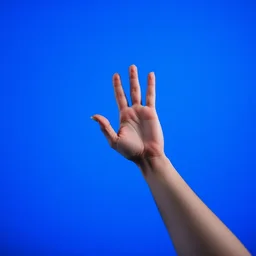 hand in front of a blue screen background,